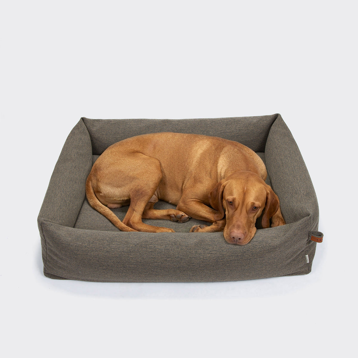 Cloud7 Sleepy linen-mix dog bed in textured mélange fabric featuring an all-round cozy support bolster.