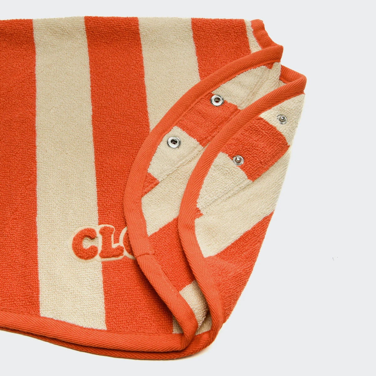 Cloud7 Wannsee dog bathrobe in a beige and orange striped pattern made from absorbent organic cotton terry cloth.