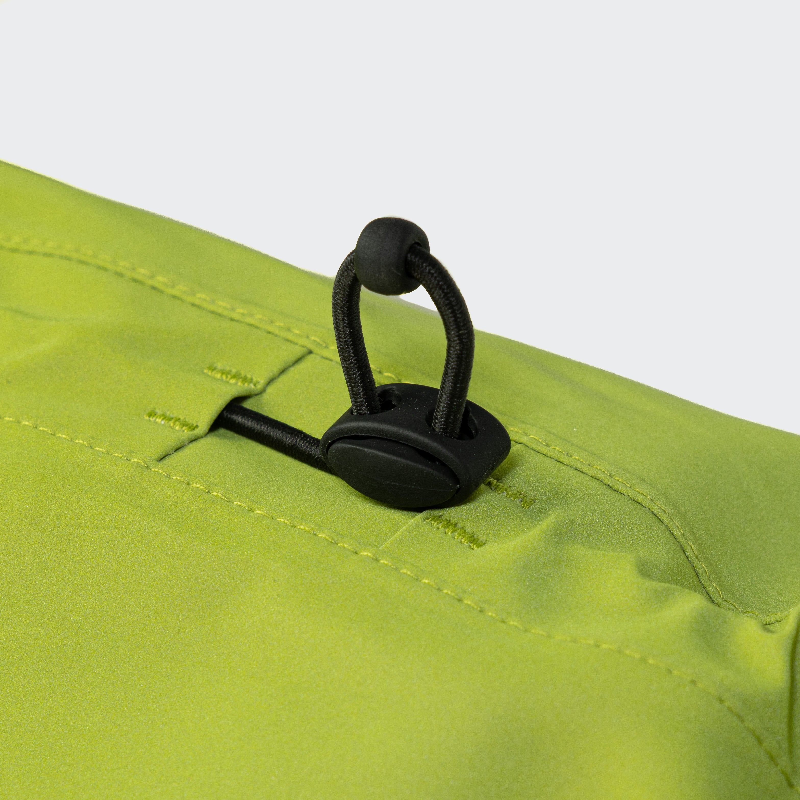 Cloud7 AKTIV reflective dog raincoat in high-visibility color, showcasing the extended shape and relaxed cut for full body coverage on a dog.