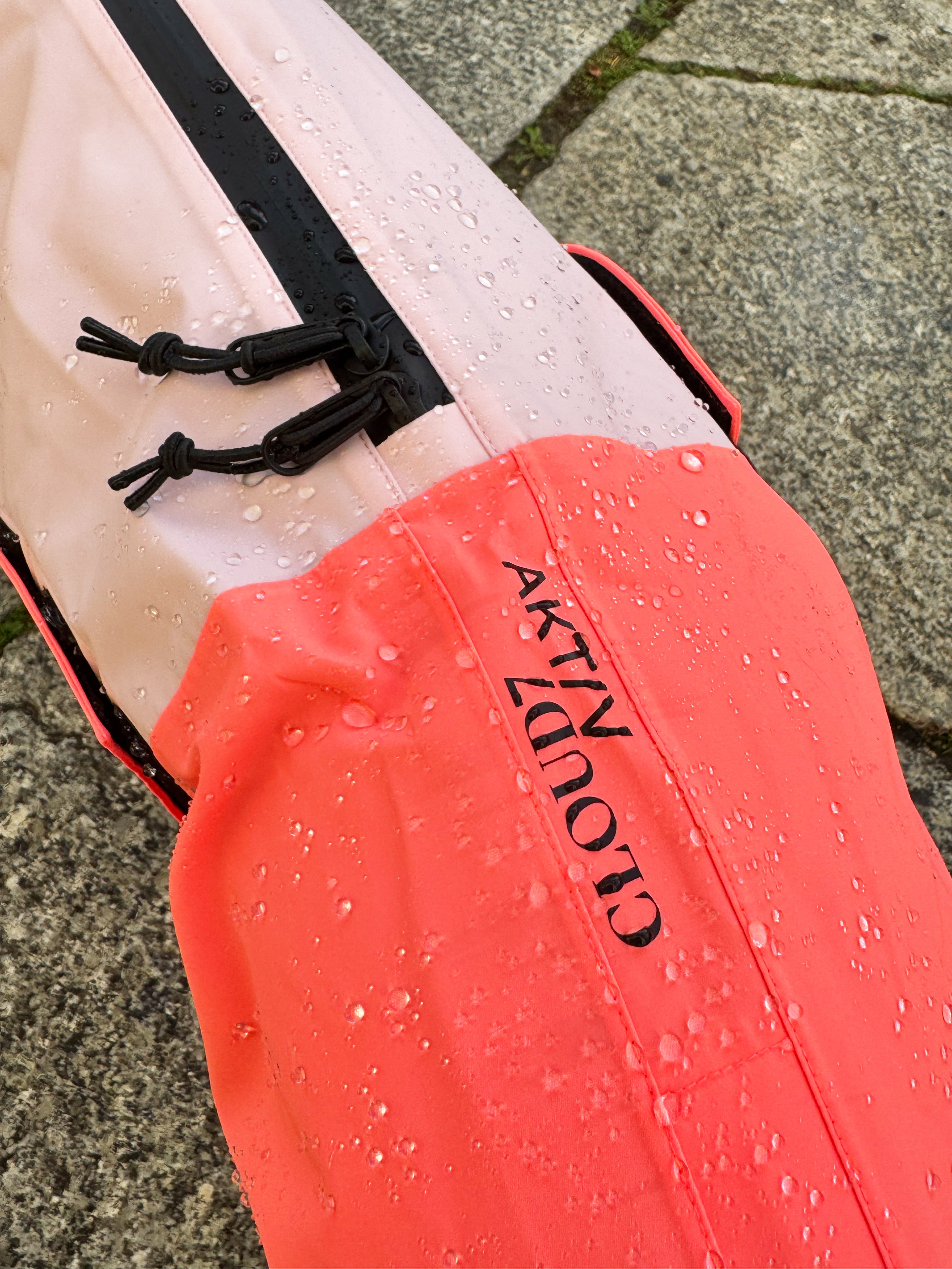 Cloud7 AKTIV reflective dog raincoat in high-visibility color, showcasing the extended shape and relaxed cut for full body coverage on a dog.