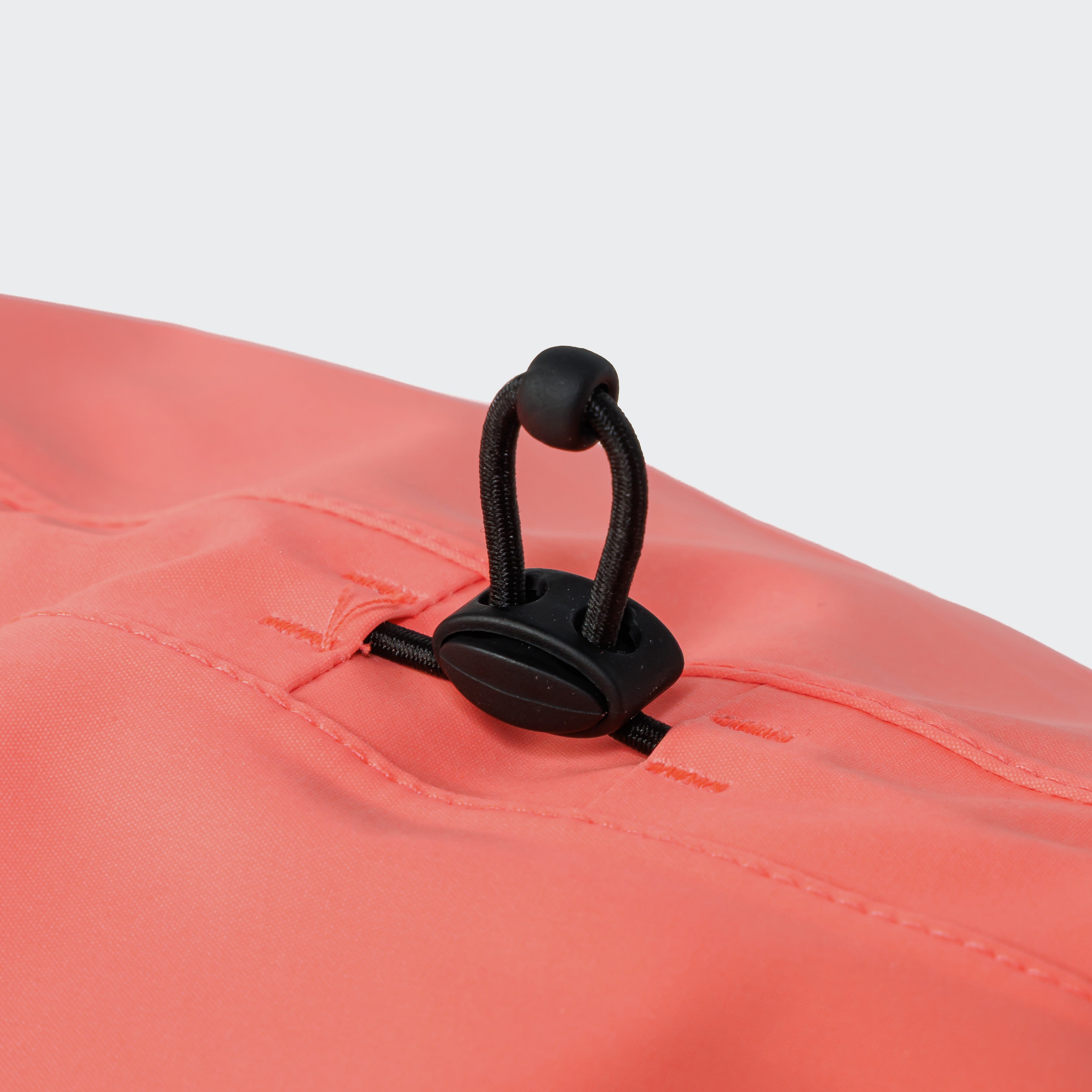 Cloud7 AKTIV reflective dog raincoat in high-visibility color, showcasing the extended shape and relaxed cut for full body coverage on a dog.